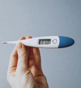thermometer in hand
