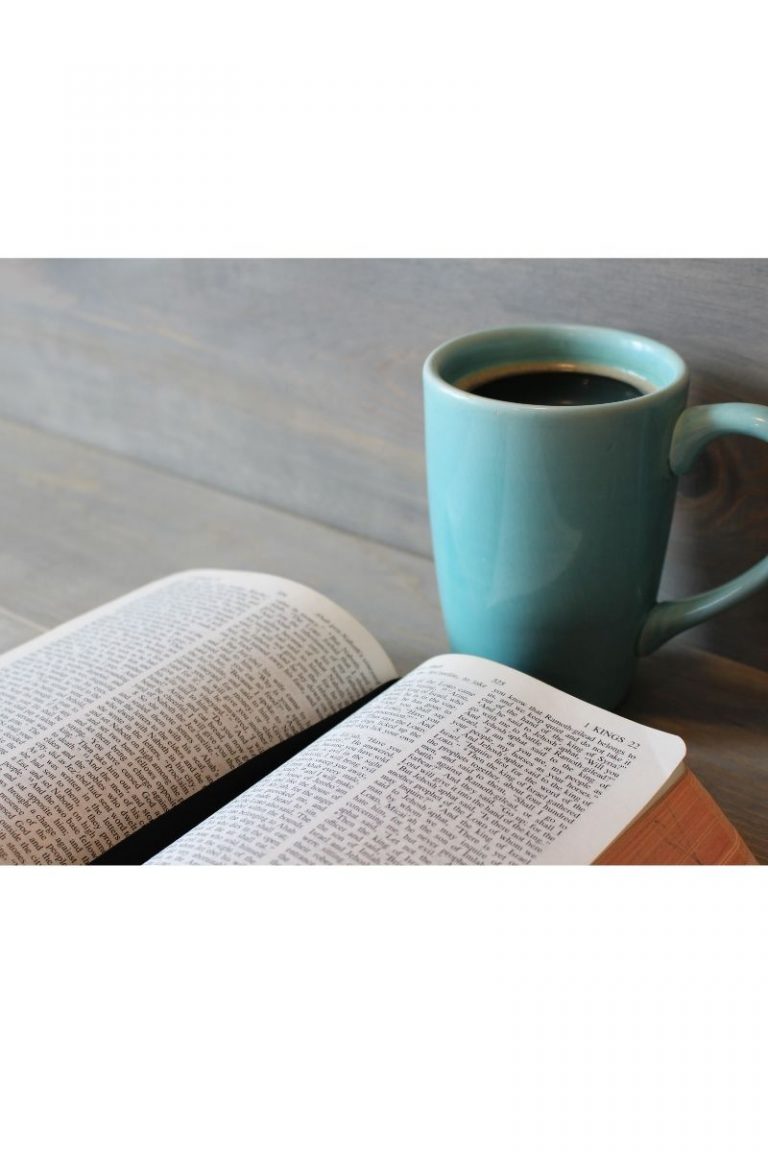 opened bible and a cup of coffee