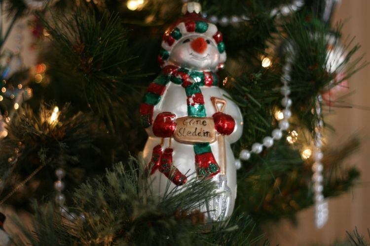 vintage snowman ornament on a christmas tree