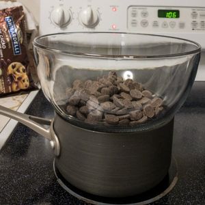pot with glass bowl on top to melt chocolate on the stove