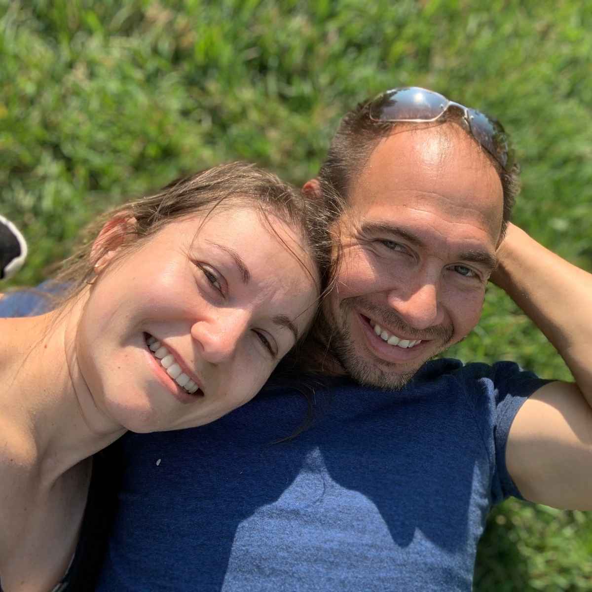 husband and wife smiling