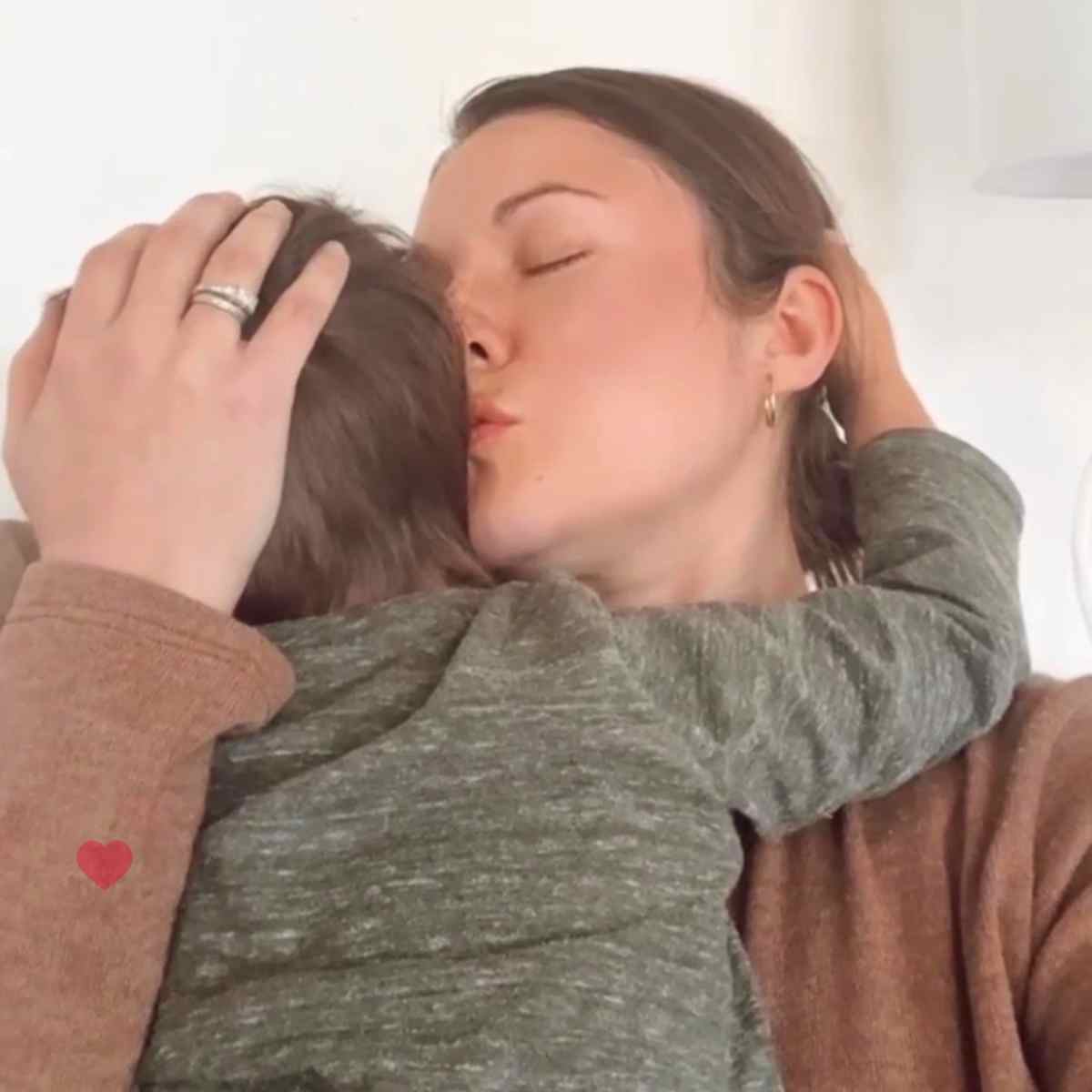 mom hugging and kissing her toddler