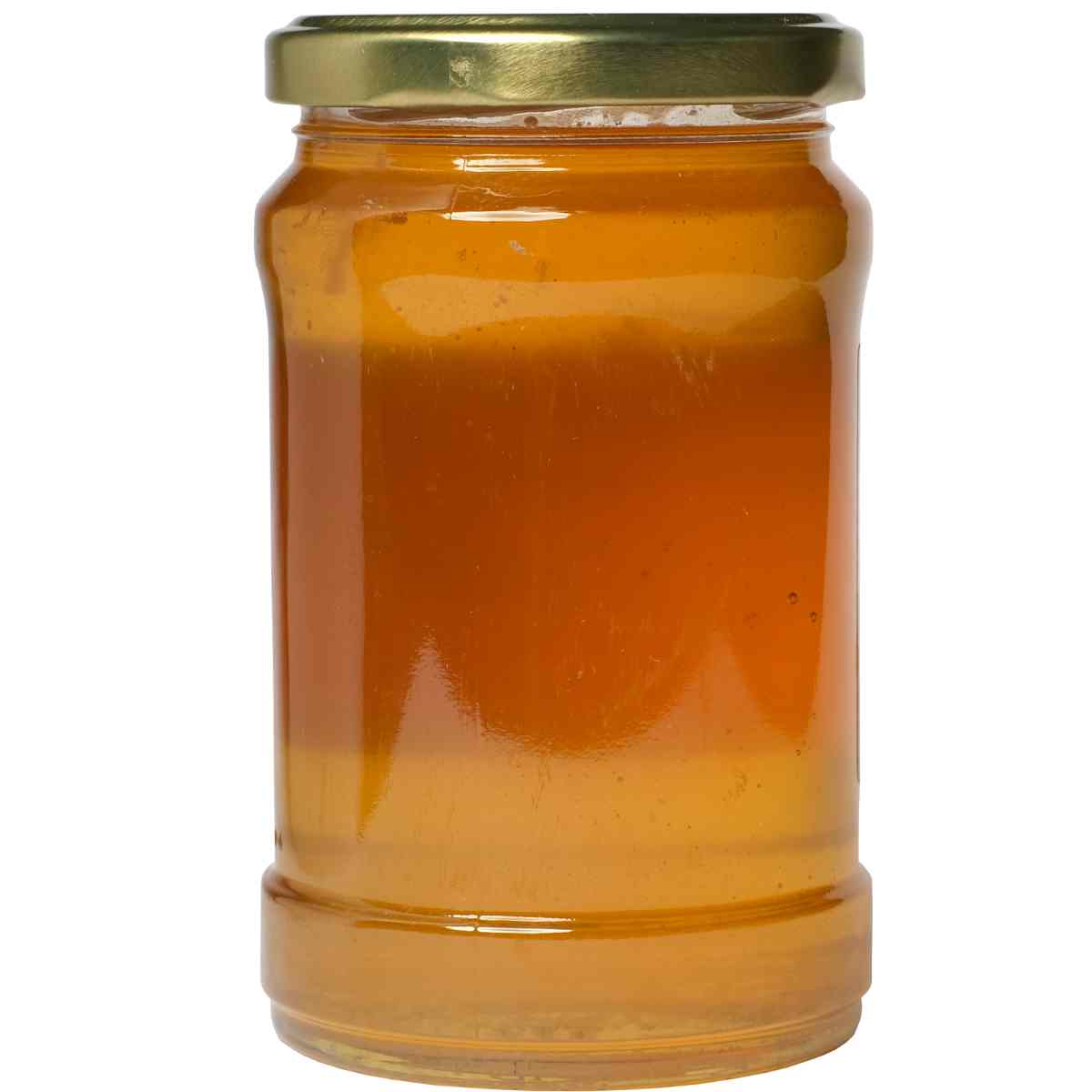 an old glass pasta sauce jar filled with gravy