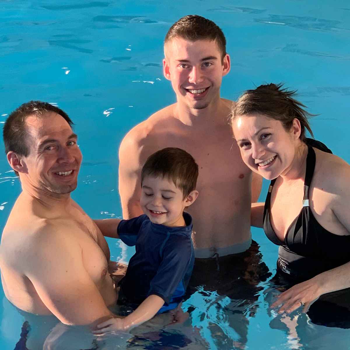 happy family in a swimming pool