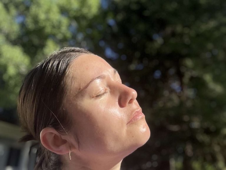a mom taking 5 minutes to feel the sunshine on her face